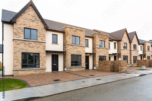 фотографія Newly built row houses for sale on a winter day