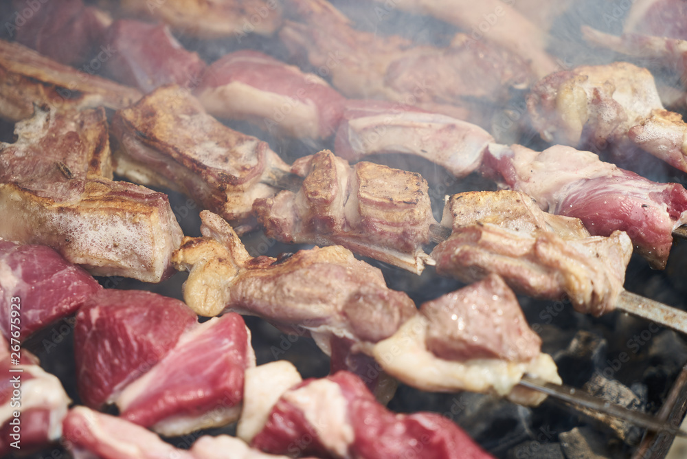 Preparation of shish kebab, close-up. Grilled shish kebab Preparation of shish kebab, close-up. Grilled shish kebab