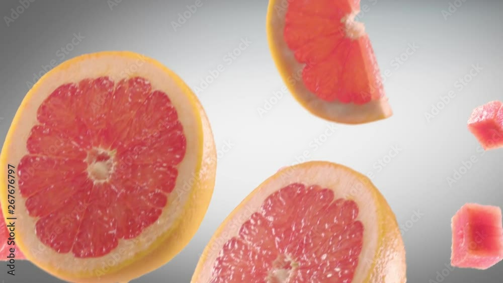Grapefruit with Slices Falling on Dark Grey Background Grapefruit with Slices Falling on Dark Grey Background