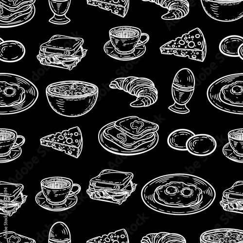 Vector hand drawn seamless pattern of breakfast.Eggs, toasts, cheese, coffee, croissant, sandwich and porridge in the engraving style on black background.