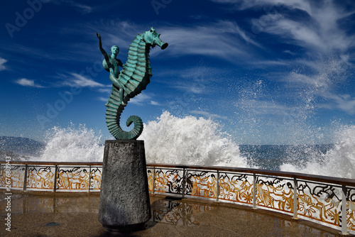The Boy on a Seahorse sculpture Puerto Vallarta Malecon with splash of Pacific sea photo