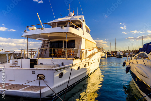 White luxury yacht in a sea harbor of Hurghada, Egypt. Marina with tourist boats on Red Sea