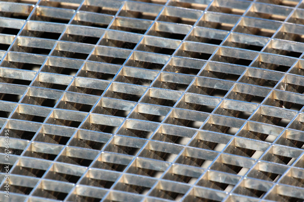 Iron gutter grates and metal vent grids as background Iron gutter grates and metal vent grids as background
