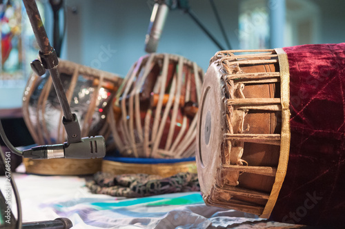 Indian drums, including a tabla and a mrdanga on a stage waiting to be played photo