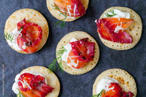 Party blinis with beetroot cured salmon, cream and horseradish 