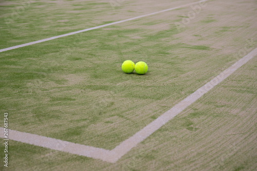 Two tennis balls on the omni court