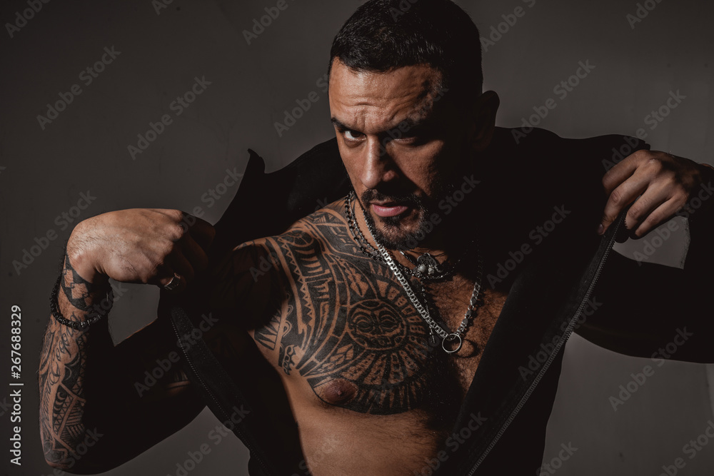 Metrosexual guy. Attractive fashionable macho. Serious confident masculine  glance. Fashion industry. Muscular athletic sexy male with tattoos.  Confident and handsome brutal man. Male fashion Stock Photo | Adobe Stock