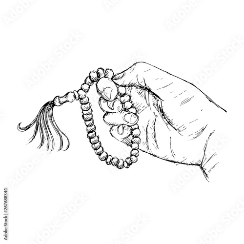фотографія Hands holding a Muslim rosary. Hand drawing illustration.