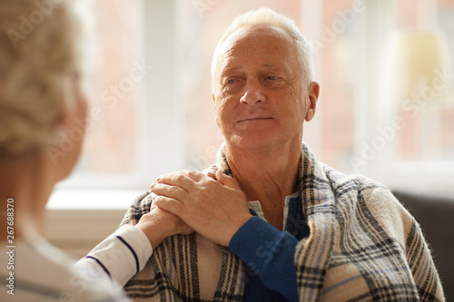 Photos Portrait od unrecognizable of senior woman supporting husband laying hand on his