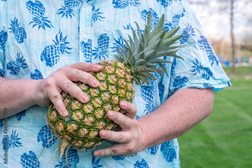 Chubby man in pineapple shirt holding a pineapple tropical vibes Stock Photo Adobe Stock