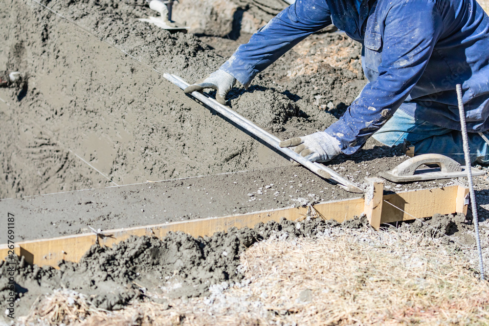Pool Construction Worker Working With A Smoother Rod On Wet Concrete Pool Construction Worker Working With A Smoother Rod On Wet Concrete