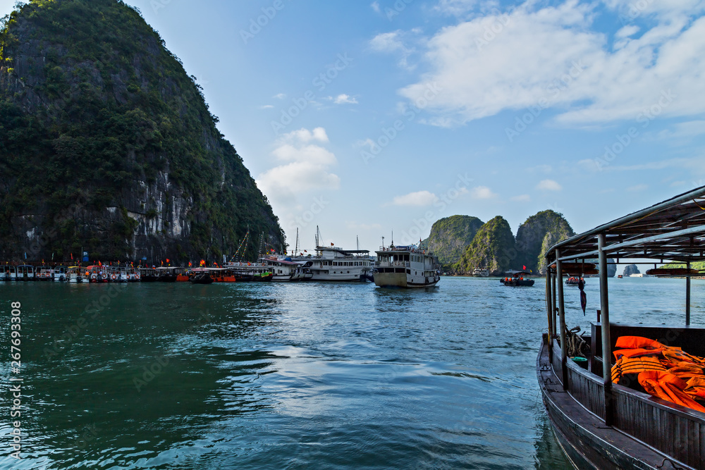 Naklejka premium Vietnam, Ha Long Bay Cruse liner junk sails in sea landscape travel