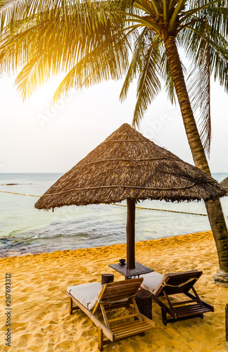 Deckchairs and parasol tropical beach sea landscape  romantic paradise