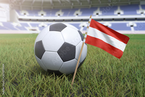 Austrian flag in stadium field with soccer football