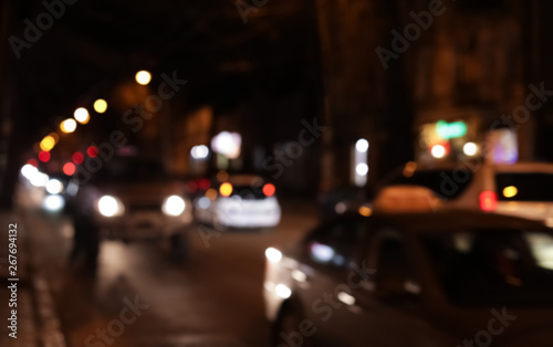Blurred view of city street with traffic at night
