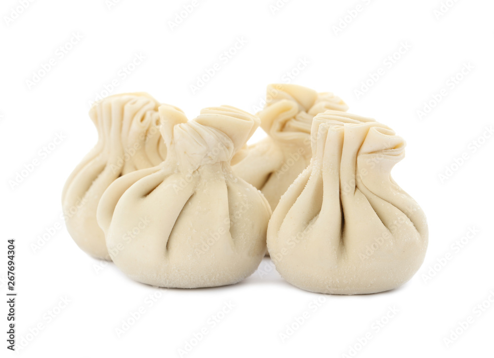 Heap of raw dumplings with tasty filling on white background Heap of raw dumplings with tasty filling on white background