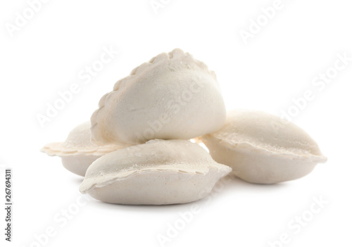 Heap of raw dumplings on white background