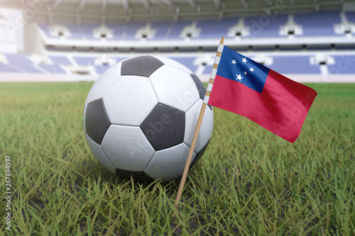Samoan flag in stadium field with soccer football