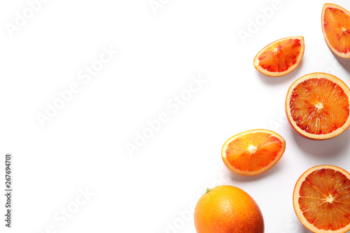 Fresh bloody oranges on white background  top view. Citrus fruits