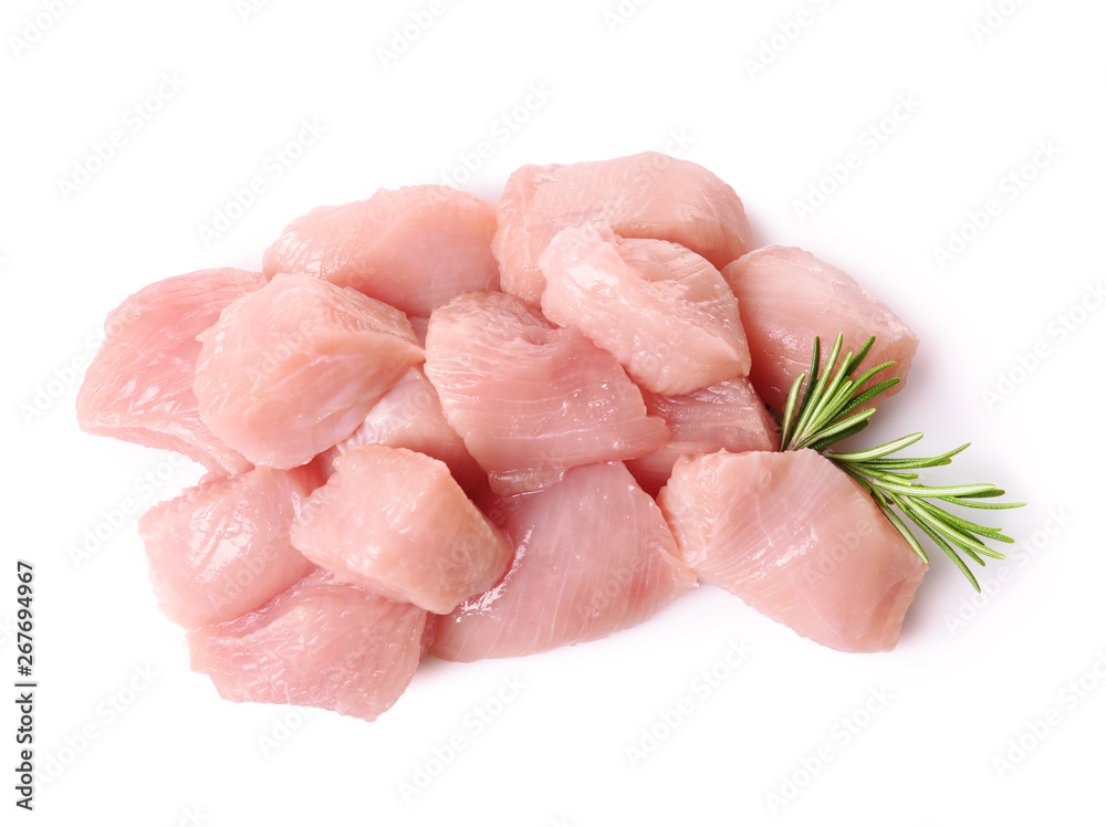 Cut raw turkey fillet with rosemary on white background, top view Cut raw turkey fillet with rosemary on white background, top view