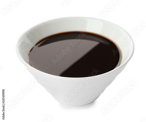 Bowl of soy sauce on white background