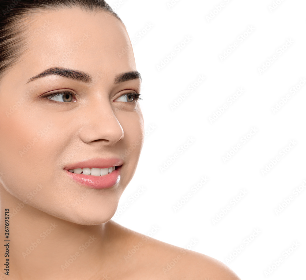 Portrait of young woman with beautiful face and natural makeup on white background, closeup