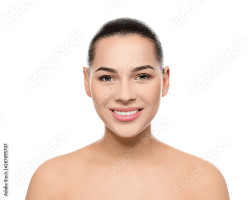 Portrait of young woman with beautiful face and natural makeup on white background