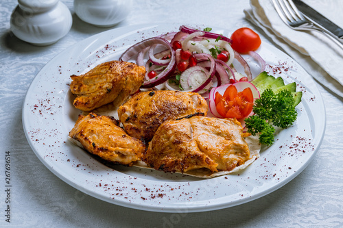 chicken kebab on white plate