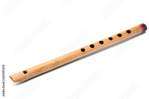 Fototapet Wind musical instrument flute on white background.Pipe