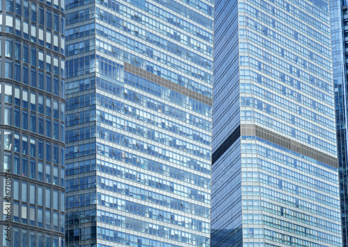 close up on modern office building with blue glass windows