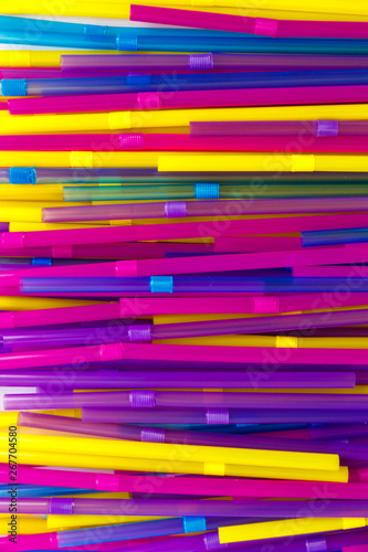 Set of colorful tubes for cocktails. Parallel and perpendicular lie on a white background.