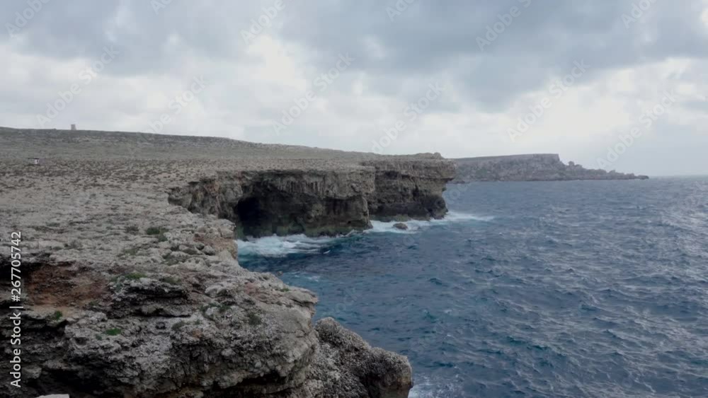 Cliff overlooking the blue sea with colored balloons that are guided by the waves 4k Cliff overlooking the blue sea with colored balloons that are guided by the waves 4k