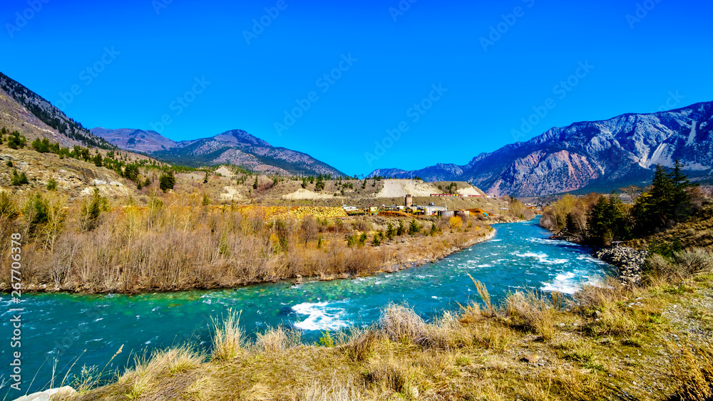 The clear turquoise waters of the Cayoosh Creek just before it runs into the Fraser River at the town of Lillooet in British Columbia, Canada