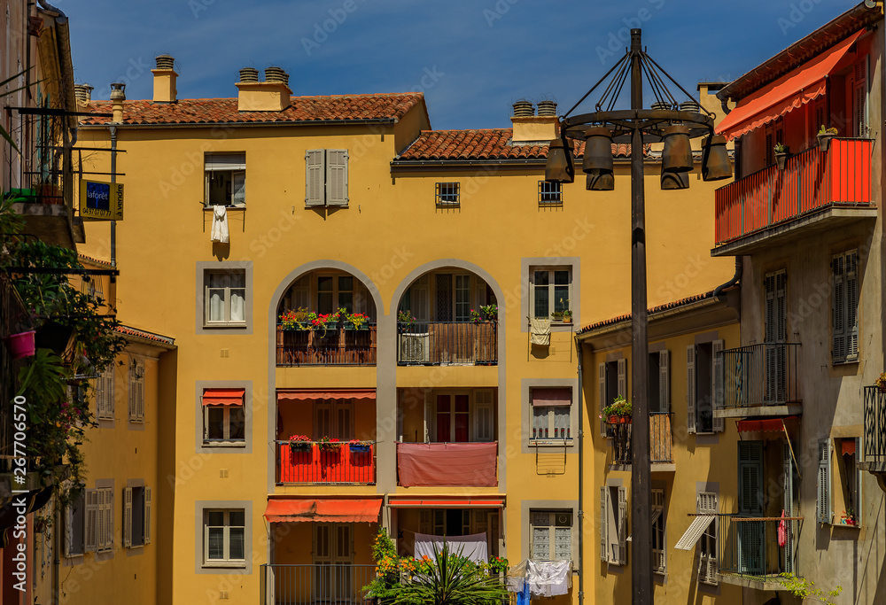 Old traditional houses in the narrow streets in the Old Town Vielle Ville in Nice in the South of France