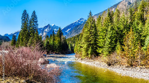 Partly frozen Cayoosh Creek which runs for the most part next to Highway 99, the Duffey Lake Road, between Pemberton and Lillooet in southern British Columbia, Canada