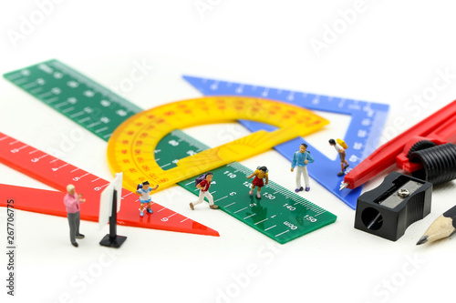 Miniature people : teacher and student with Group of stationery tools Educational tools supplies back to school concept.