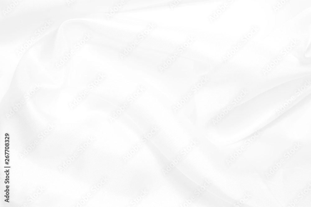 Smooth elegant white silk or satin luxury cloth texture as wedding background, White cloth background abstract with soft waves.