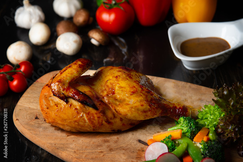  roasted chicken on a wooden board