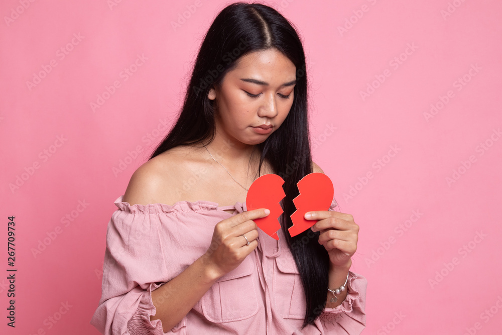 Beautiful young Asian woman with broken heart. Beautiful young Asian woman with broken heart.