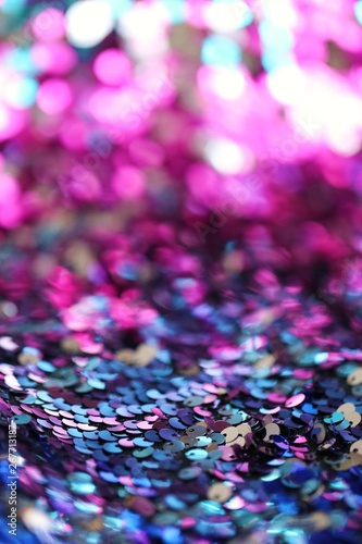 Sequins multicolored blurred bokeh background.Shine fabric sequin.Texture scales with Sequins close-up.Shiny texture sequin material