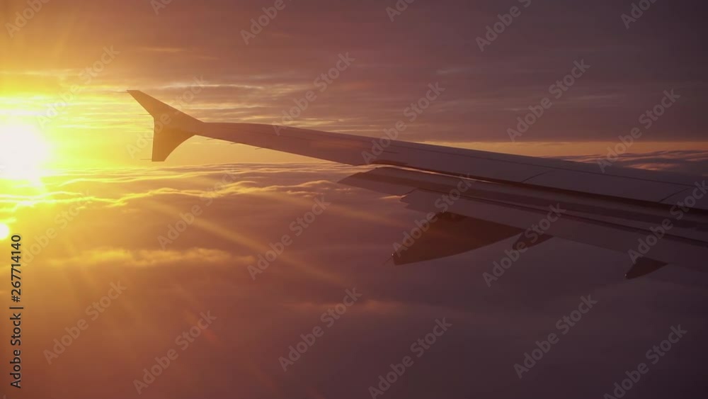 sunrise above the clouds viewing the plane wing sunrise above the clouds viewing the plane wing