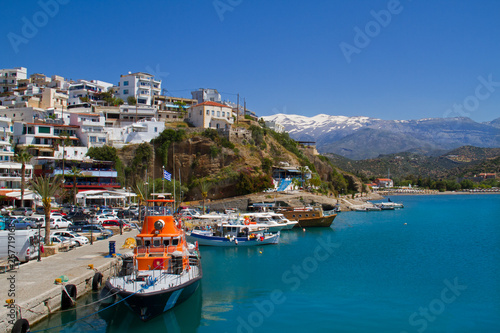 View on the charming fisherman’s village Agia Galini on the South coast of Crete, in the background the snow-covered Idi Mountains