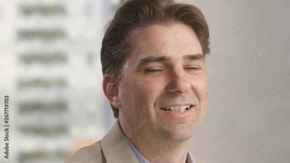 Man turning towards camera and smiling Man turning towards camera and smiling