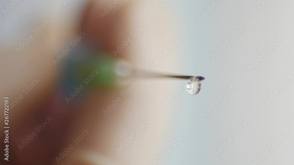 drop on a needle in a syringe,slow, vaccine, extreme macro, close drop on a needle in a syringe,slow, vaccine, extreme macro, close