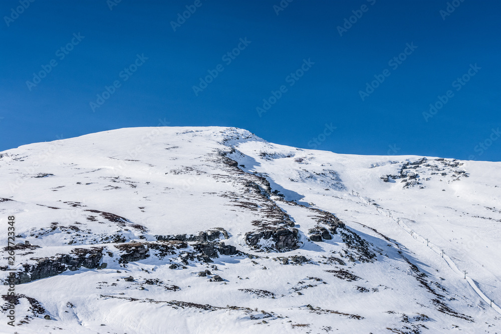 snowy mountains with blue sky