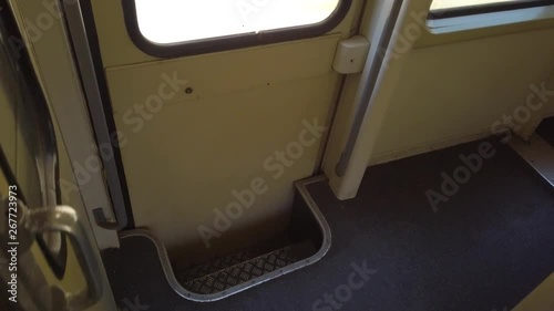 Subjective view of the exit stairs of a moving train in Morocco.