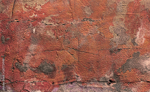 abstract red painted stucco wall. Texture of old rustic wall covered with red stucco. background texture concrete surface background. pattern of grunge red concrete painted wall. close up