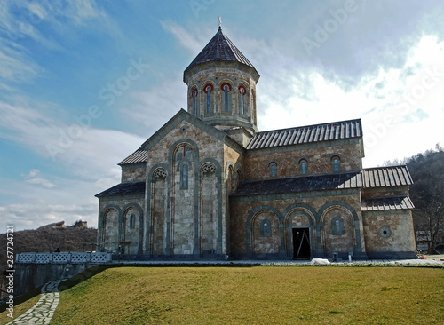 ancient monastery of Bodbe in Georgia lit by the morning sun photo