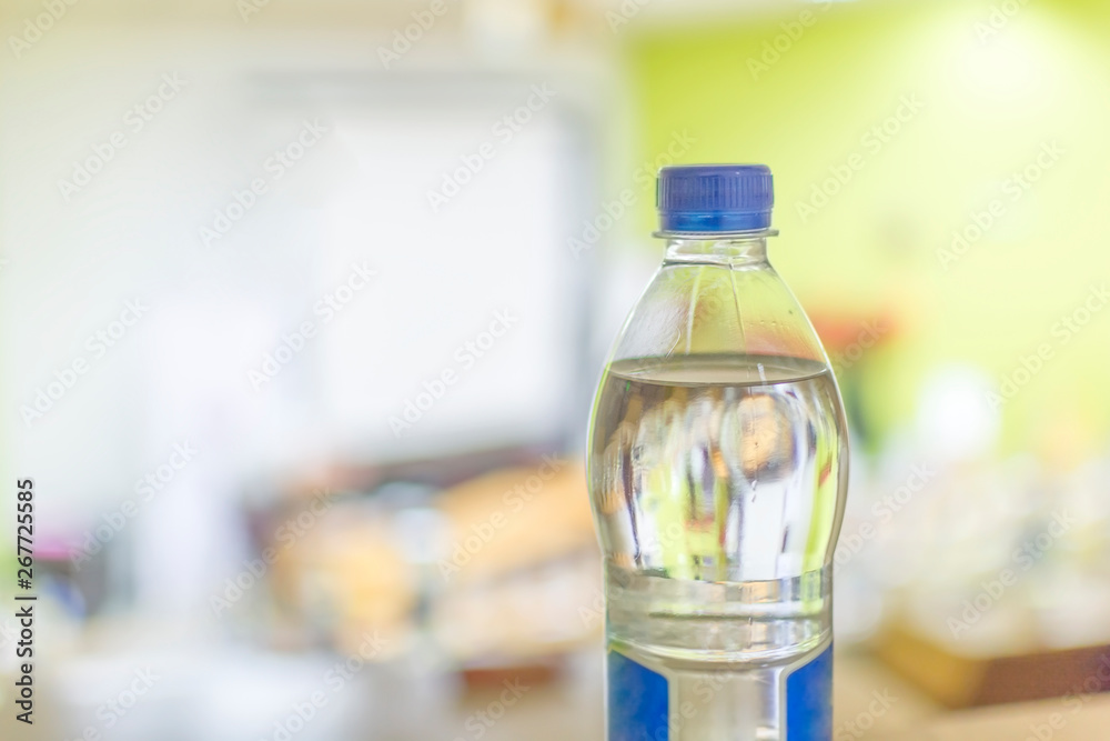 Plastic water bottle on the wooden table Plastic water bottle on the wooden table
