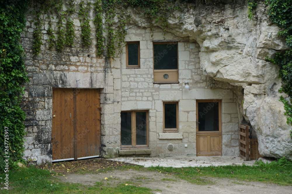 limestone troglodyte house built in the hillside in the Loire Valley, France limestone troglodyte house built in the hillside in the Loire Valley, France